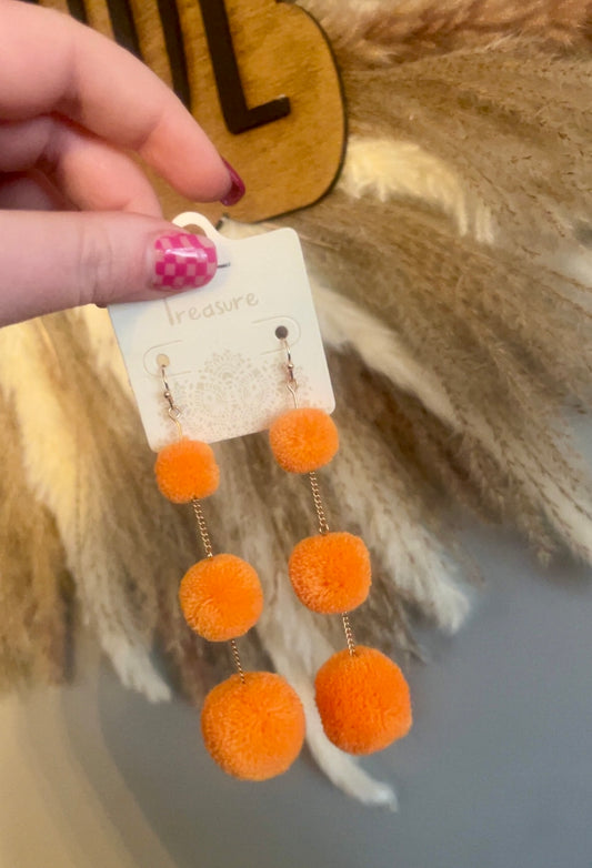 orange pom poms